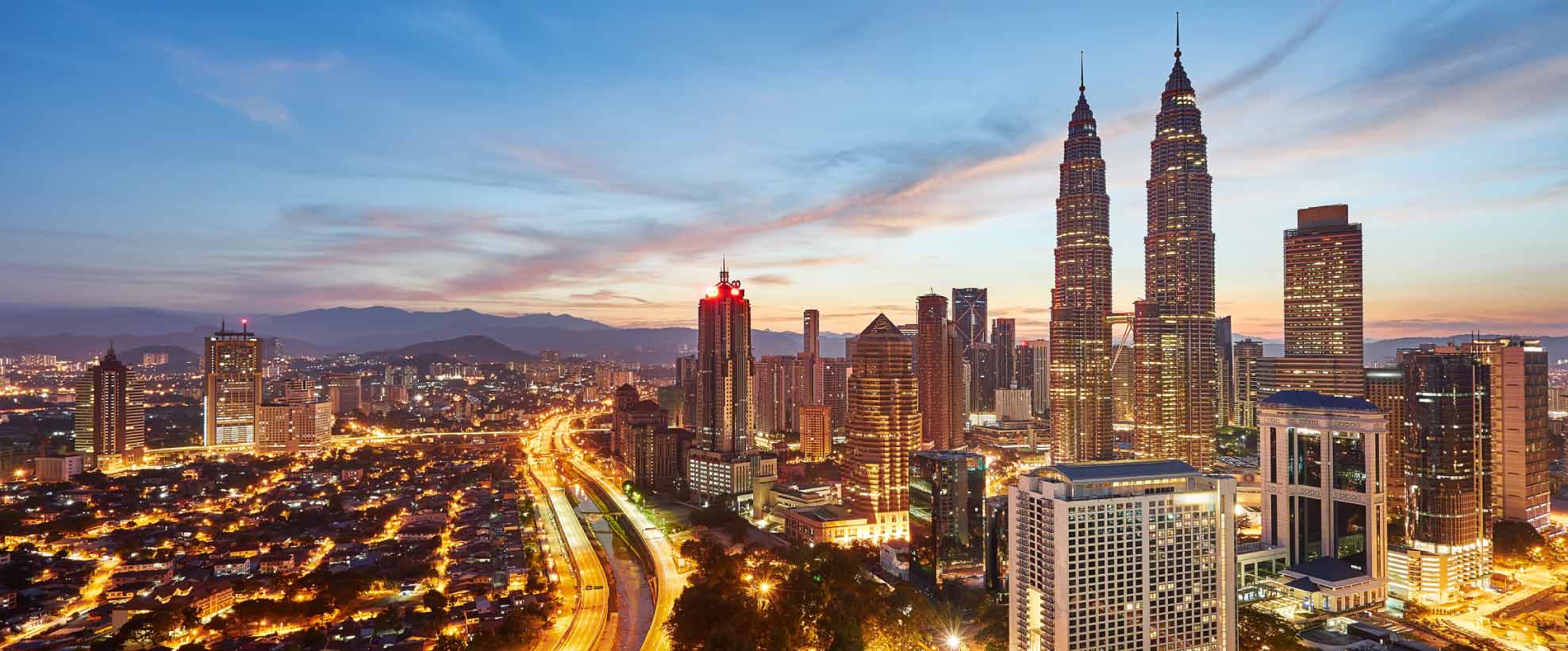 A photo of the Petronas Twin Towers against the Kuala Lumpur skyline.