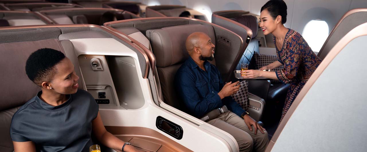 passengers receiving in-flight service drinks 